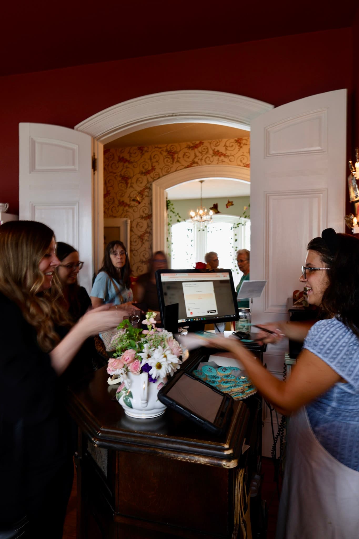 Guests welcomed at the host stand at The Tea Trolley